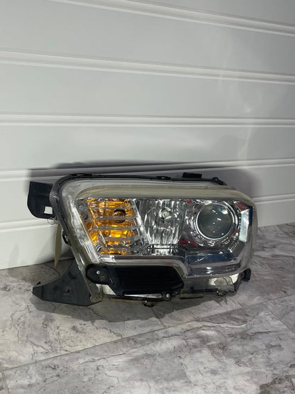 2016-23 Toyota Tacoma Left Side Halogen Headlight OEM