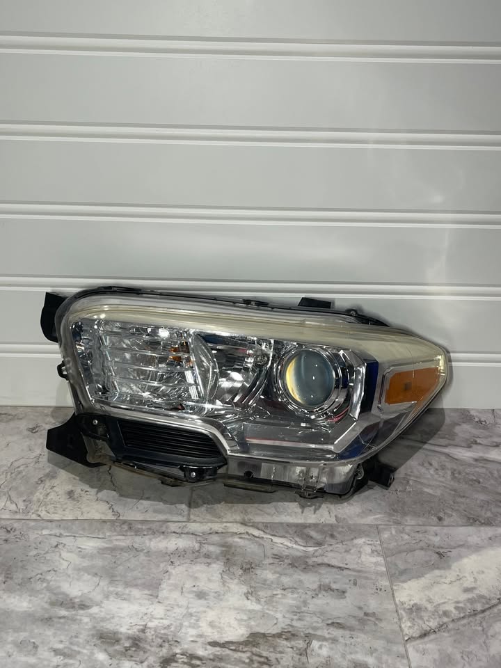 2016-23 Toyota Tacoma Left Side Halogen Headlight OEM
