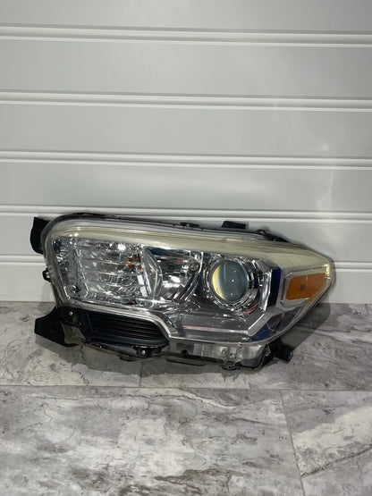 2016-23 Toyota Tacoma Left Side Halogen Headlight OEM