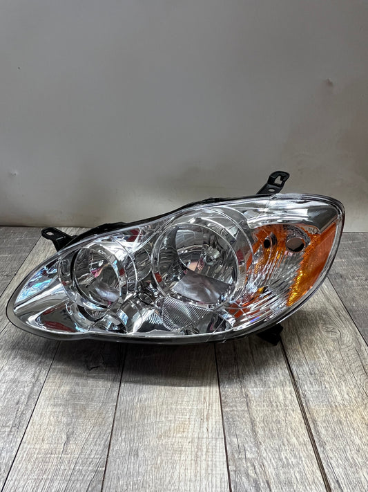 2003-08 Toyota Corolla Amber Chrome Housing Left Headlight